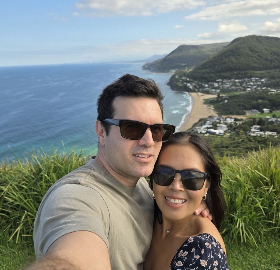 Stefano and Chantelle at a clifftop lookout over the coast