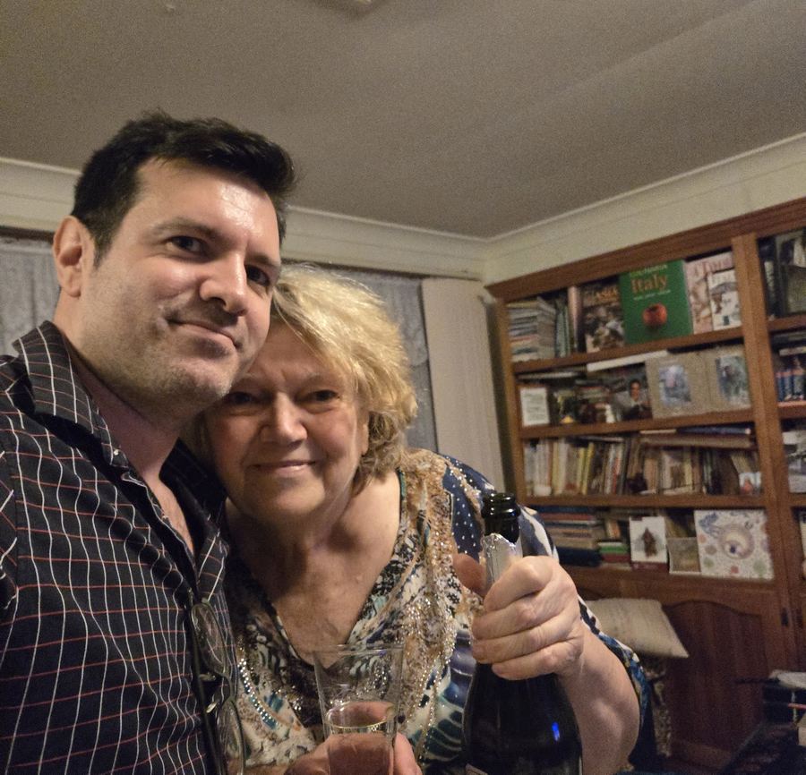 Stefano and his mum celebrating at home with a glass of bubbles